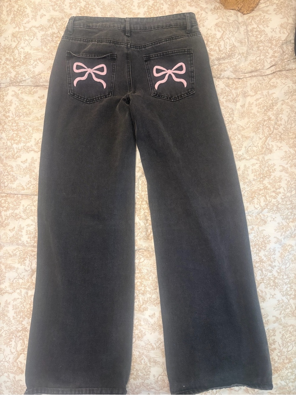 Edikted faded black jeans with embroidered bows on the back pockets